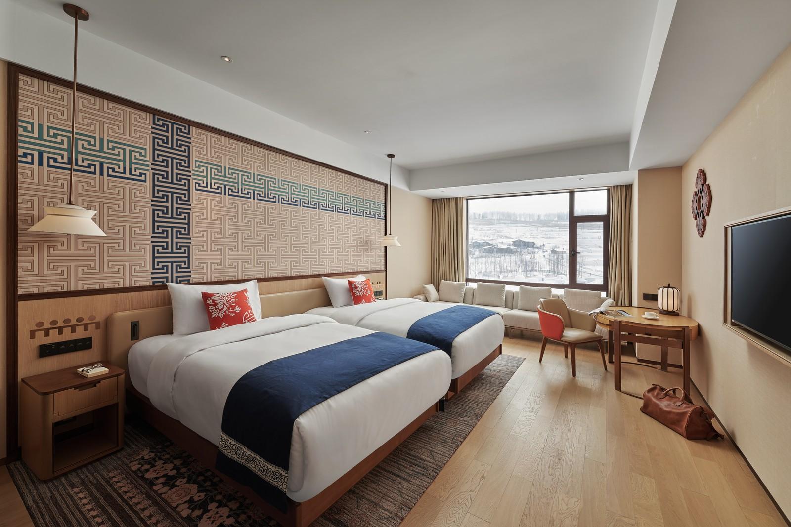 Deluxe bedroom with a snowy view at Club Med Changbaishan