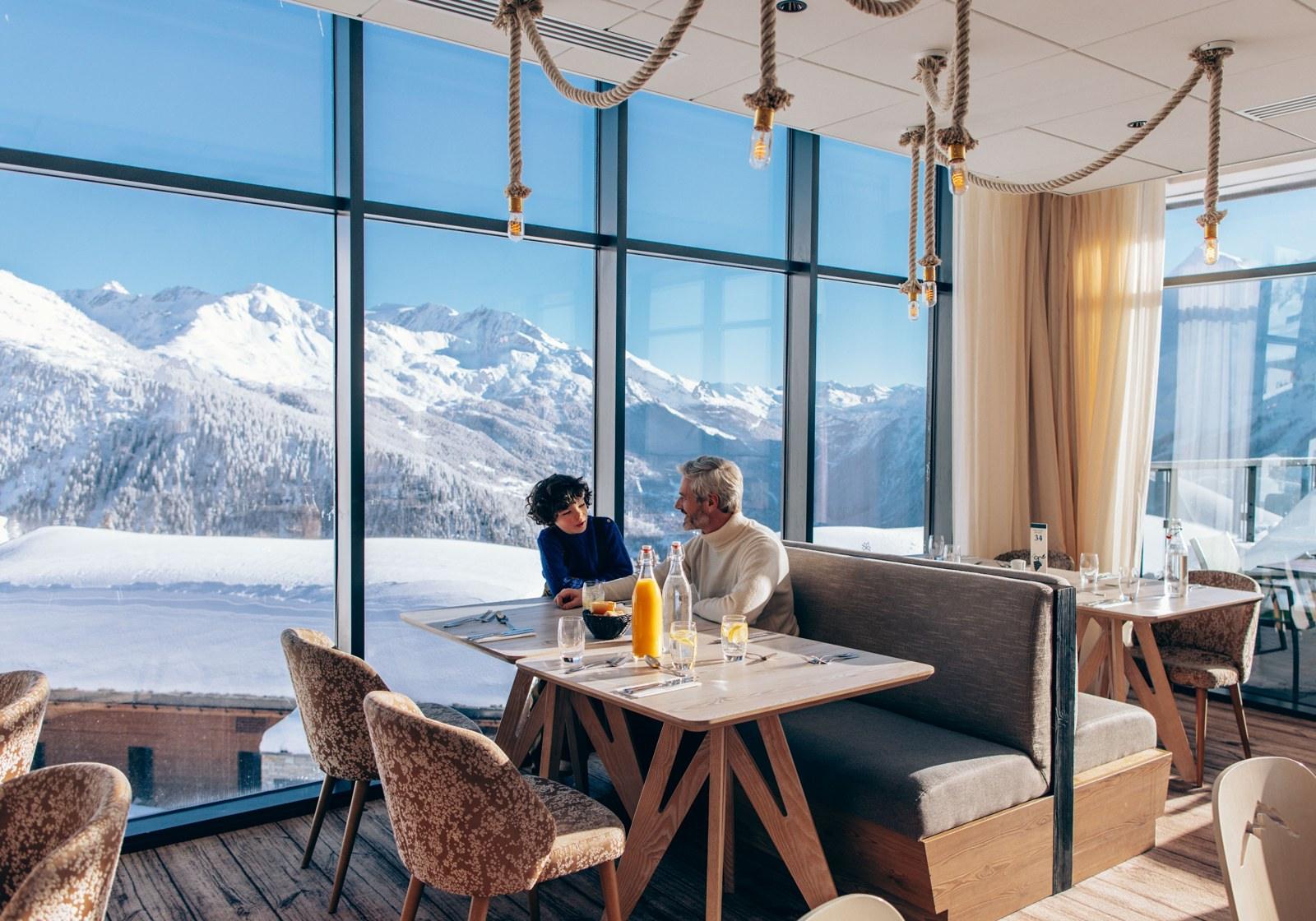 Dining with snowy mountain views at Club Med La Rosière