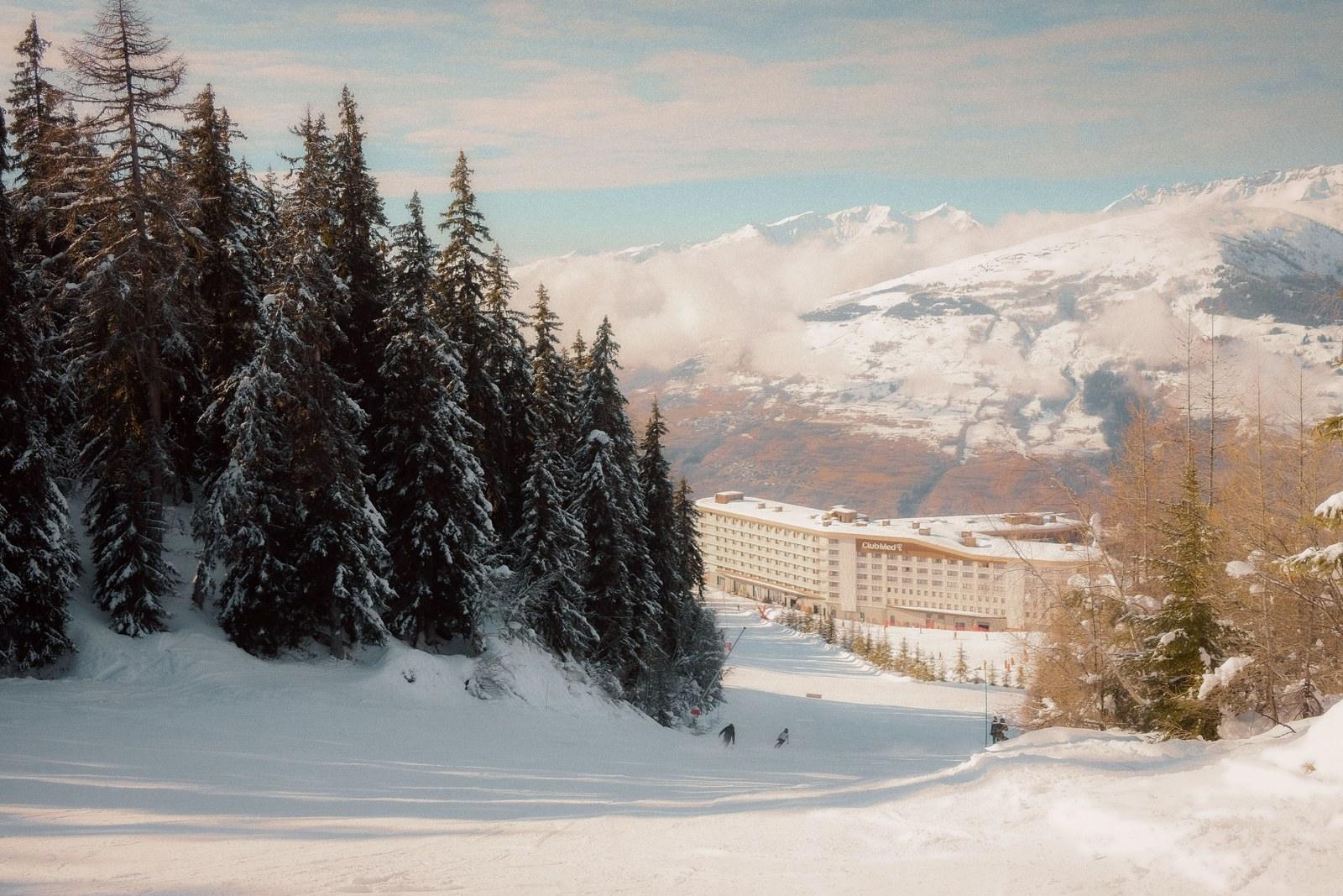 Club Med Les Arcs Panorama beyond a snowy slope