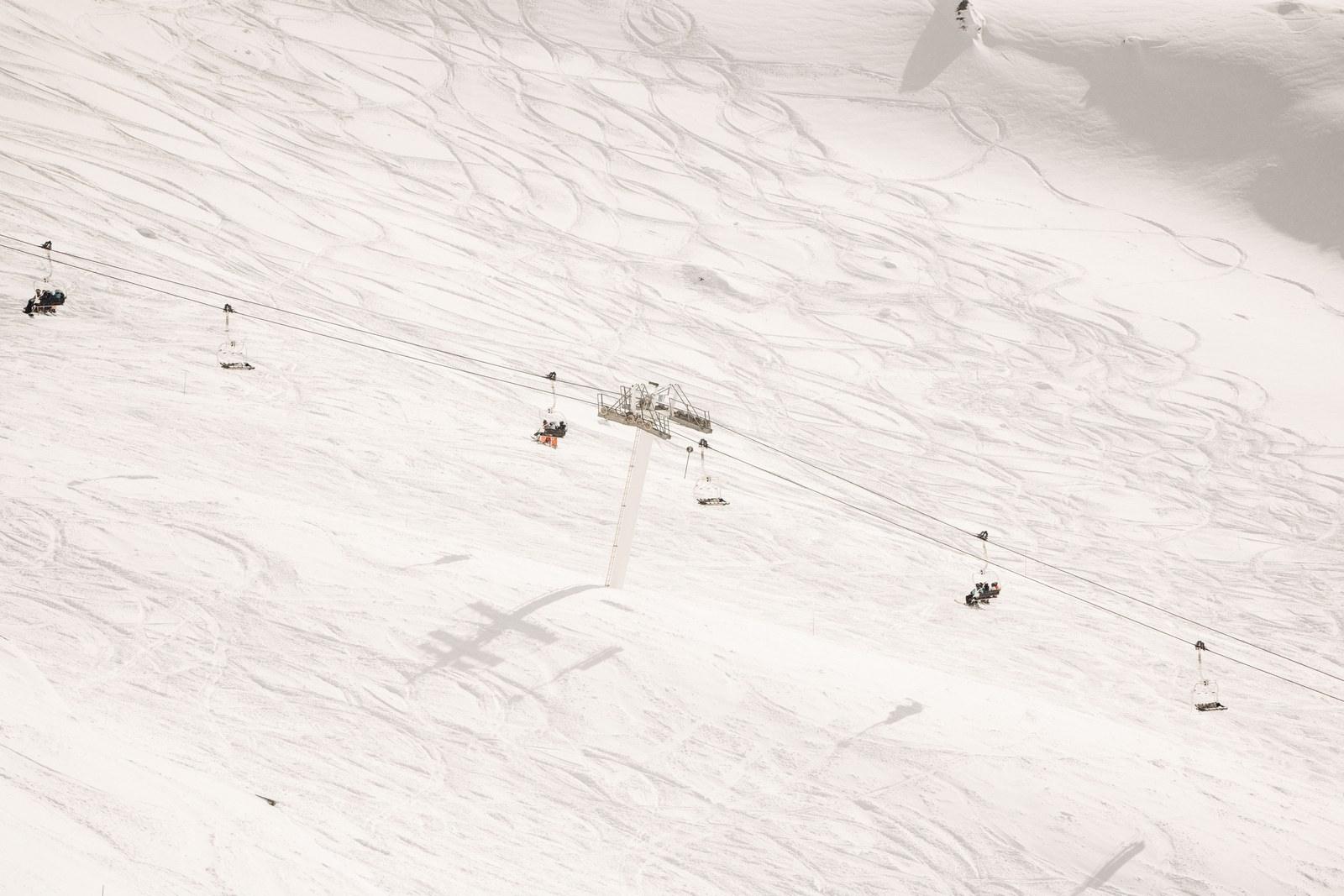 Chairlift above snow-covered ski slopes at Val Thorens
