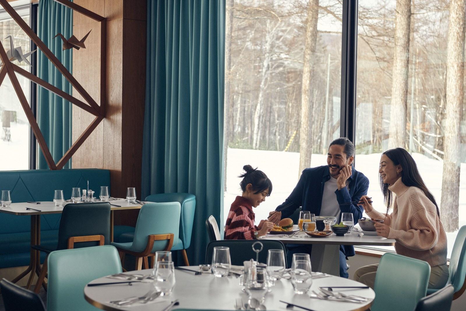 Family dining at Club Med Sahoro with snow visible outside