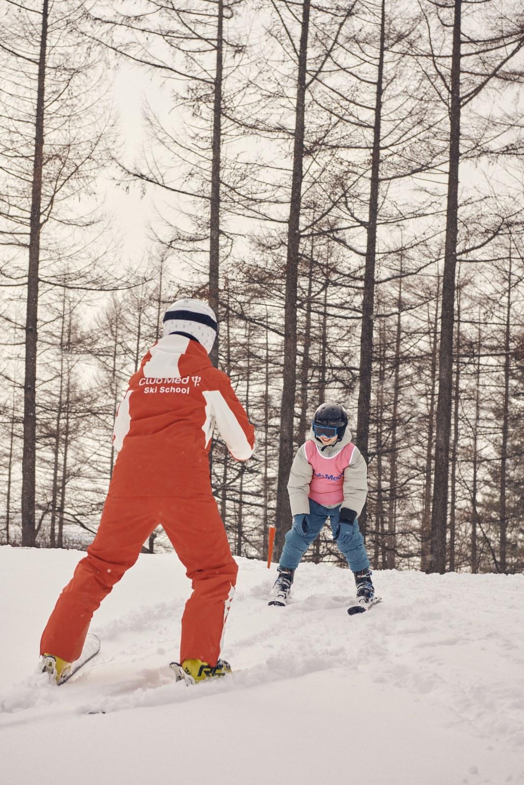 Child learning to ski with an instructor at Club Med Sahoro