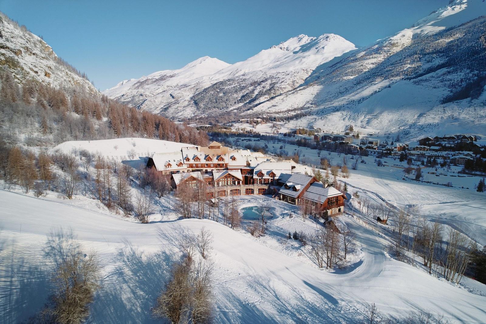 Aerial view of Club Med Serre Chevalier in a snowy mountain valley