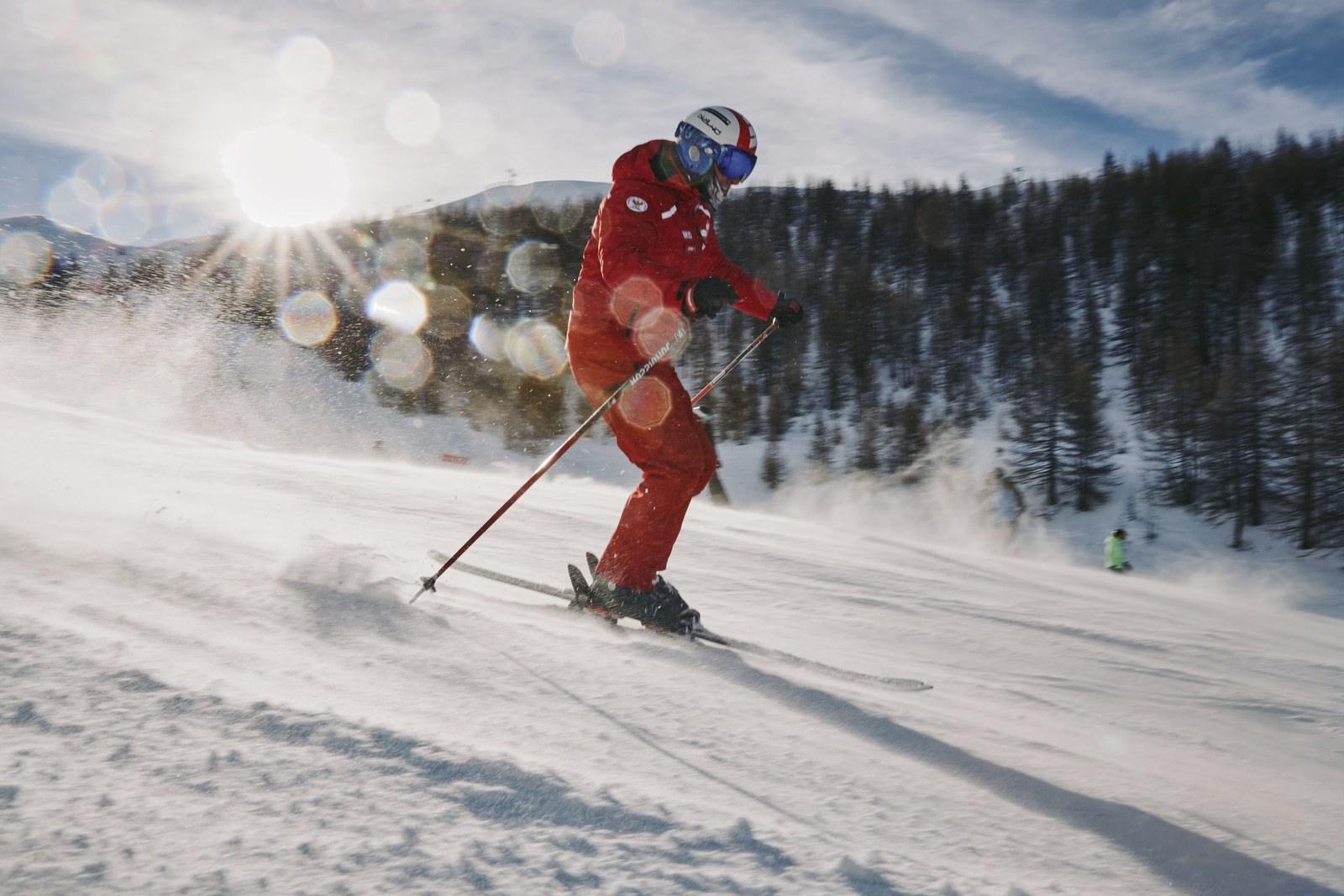 Skier descending a snowy slope at Serre Chevalier