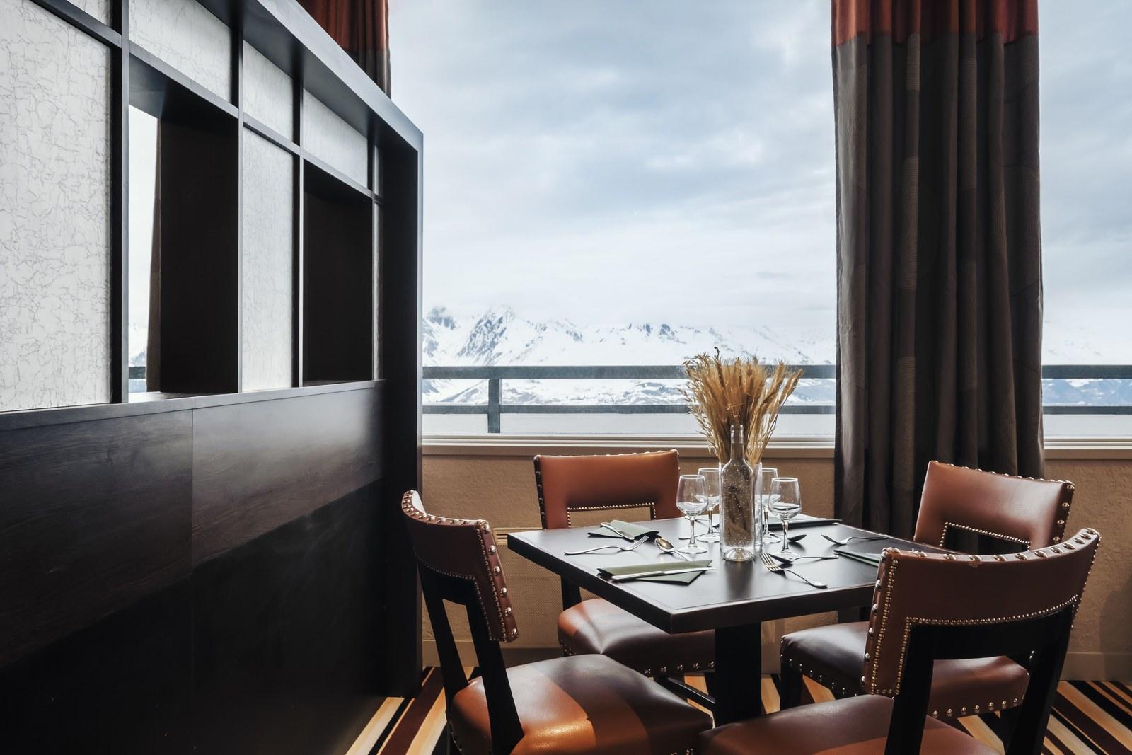 Main restaurant table overlooking snowy mountains at Club Med La Plagne 2100