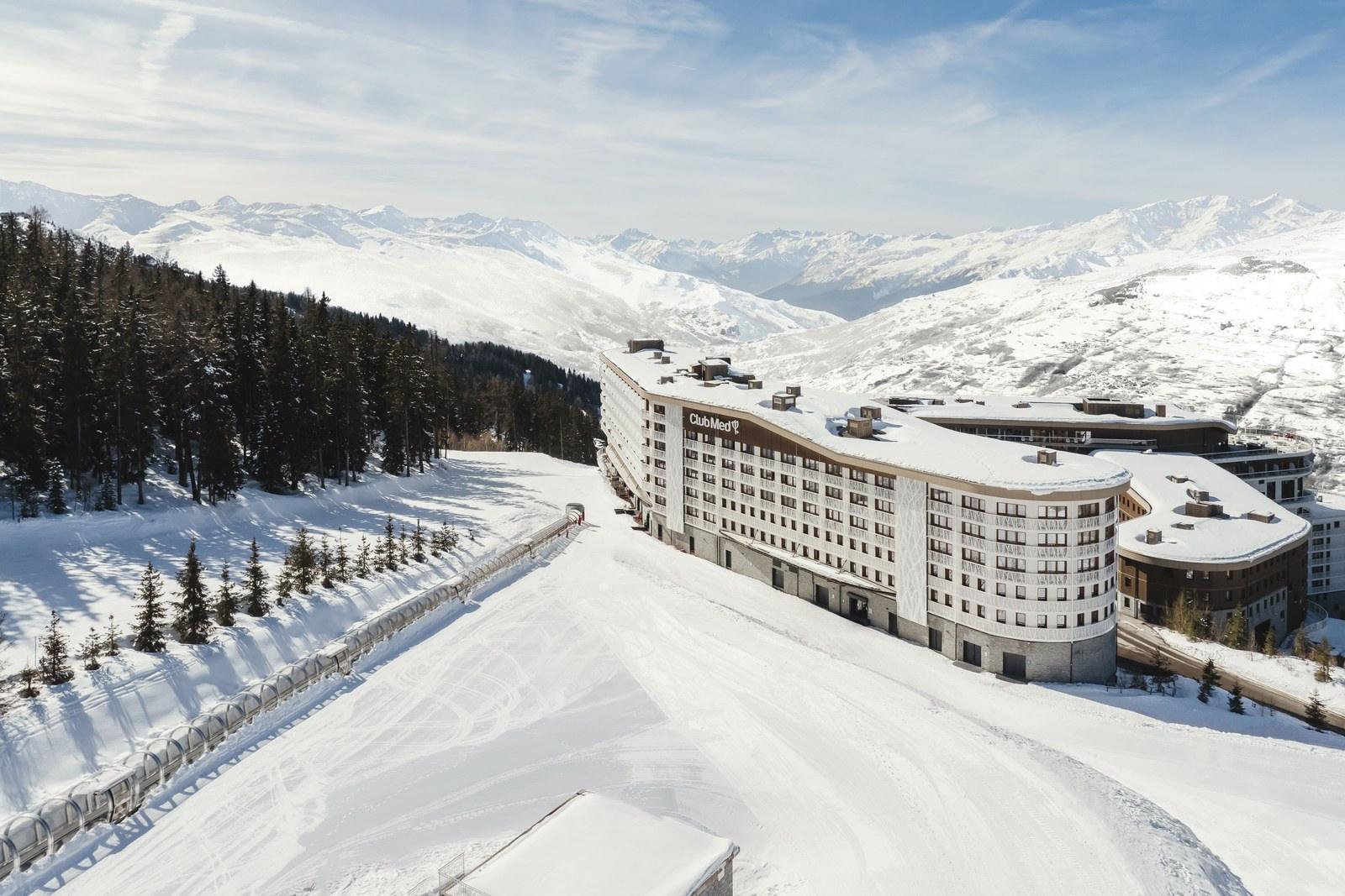 Aerial view of Club Med Les Arcs Panorama beside forest and mountains