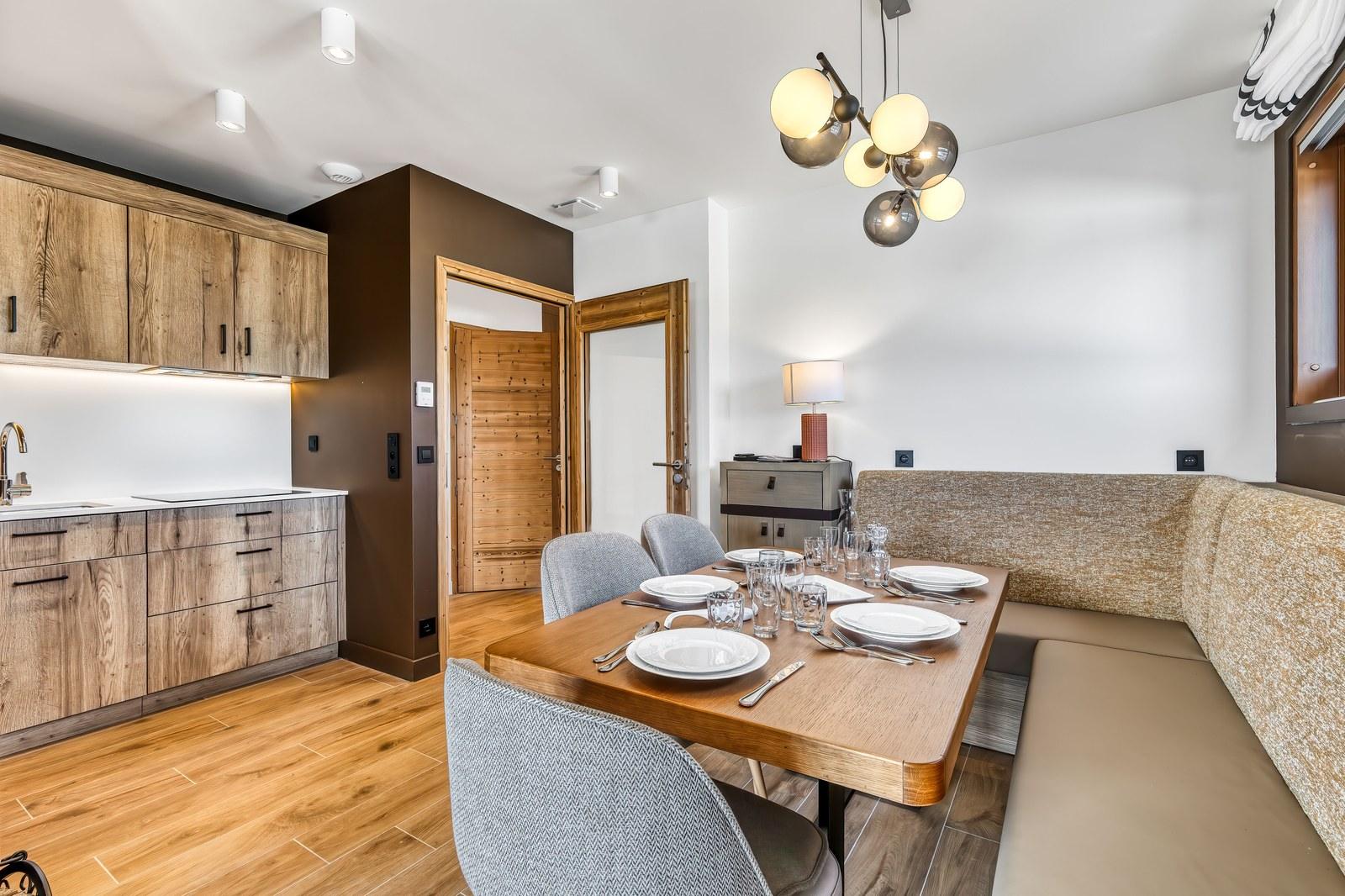 Private chalet dining table and kitchen at Grand Massif Chalet-Apartments