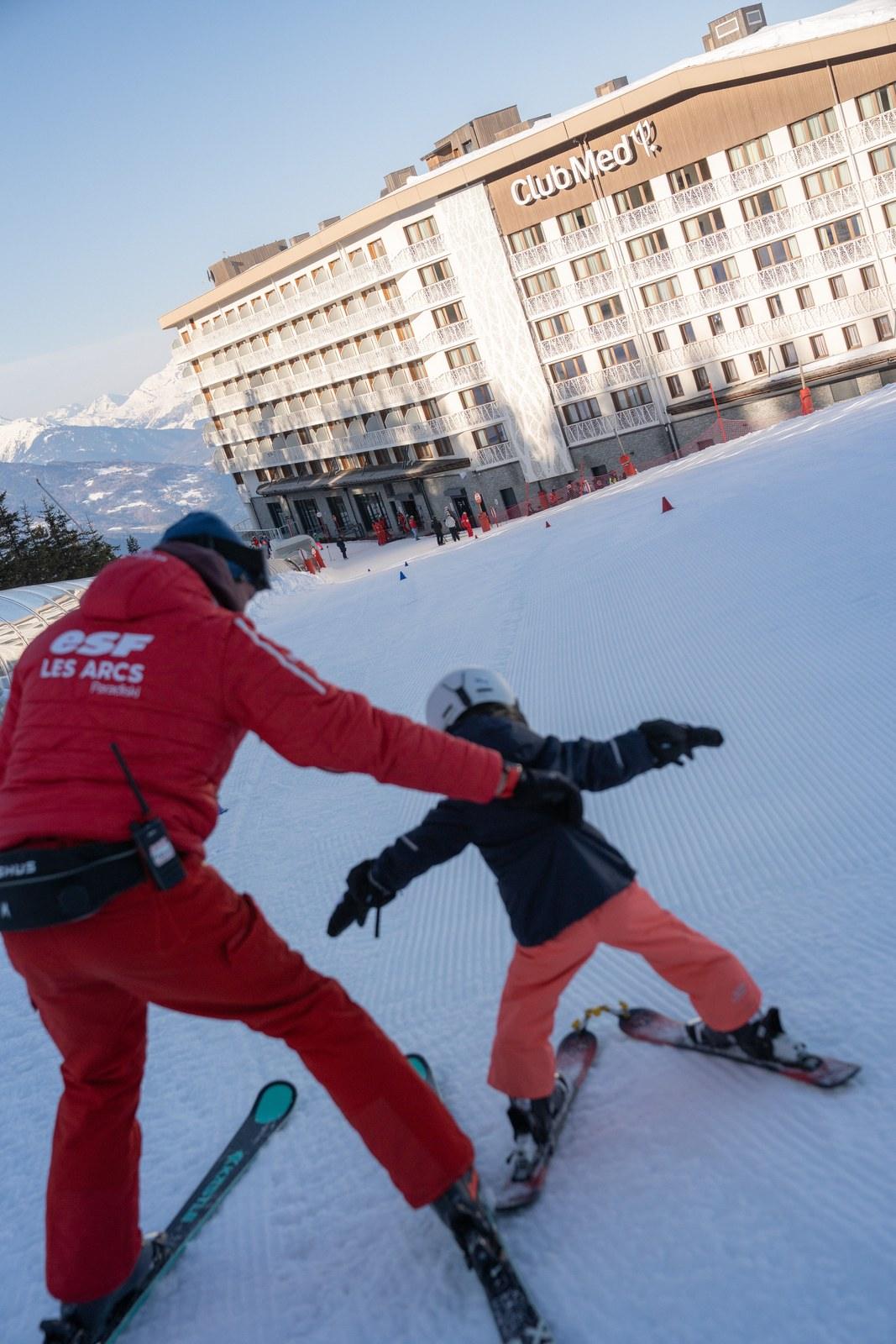 Child learning to ski outside Club Med Les Arcs Panorama