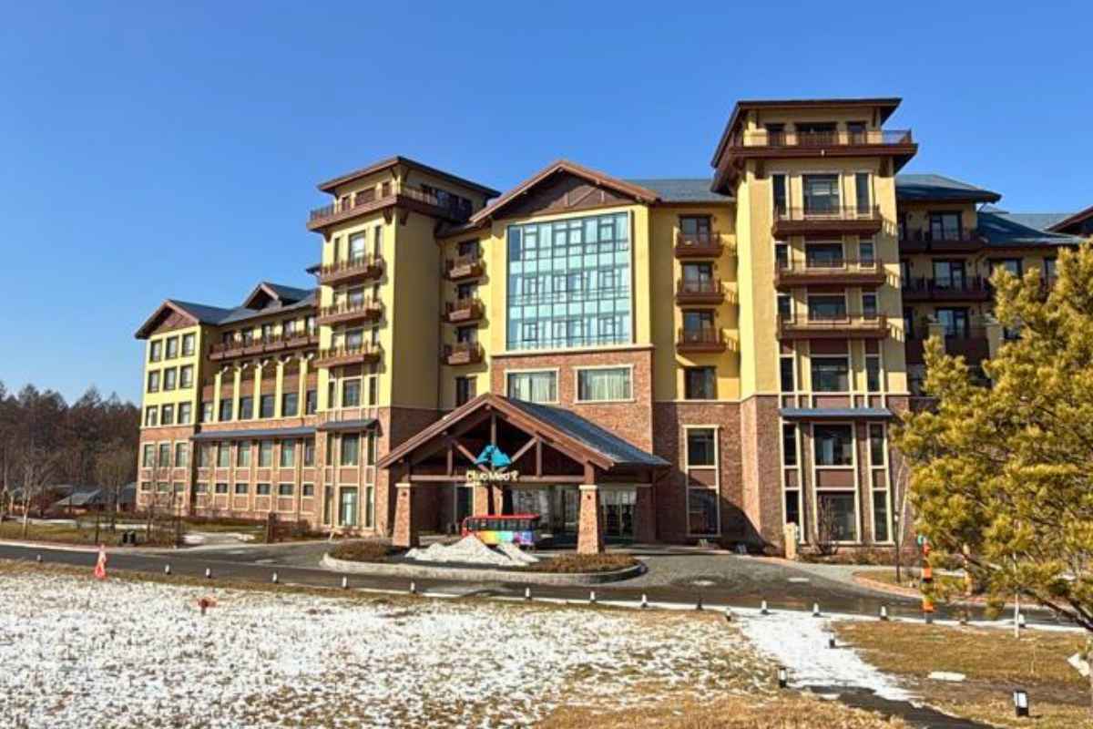 Club Med Changbaishan resort building with snow on the lawn